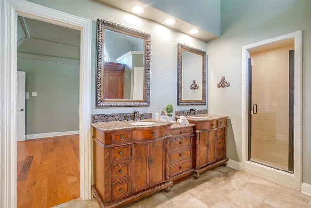 5800 Montford Dr, Colleyville, TX 76034 - full bathroom with double vanity, a stall shower, and baseboards