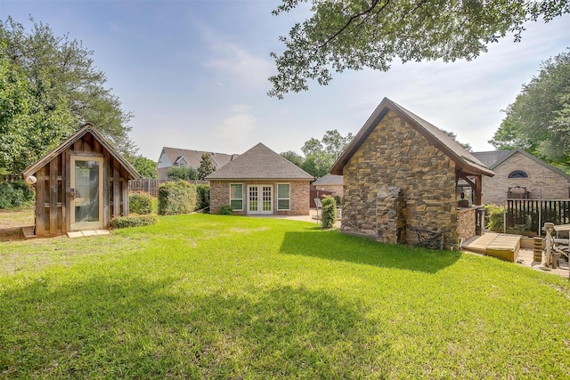 5800 Montford Dr, Colleyville, TX 76034 - rear view of house with french doors, a deck, an outbuilding, and stone siding