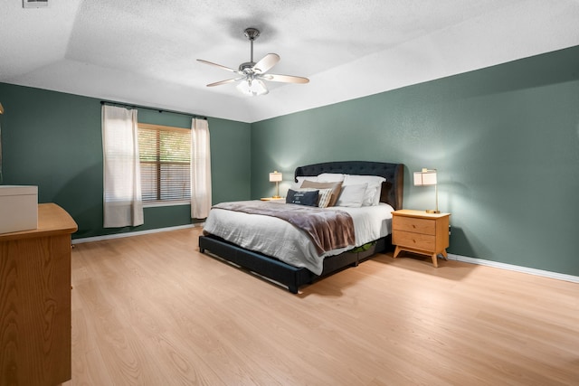 7612 Brittany Pl, Fort Worth, TX 76137 - bedroom featuring wood finished floors, baseboards, lofted ceiling, a textured ceiling, and a ceiling fan