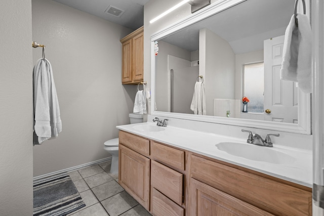 7612 Brittany Pl, Fort Worth, TX 76137 - full bathroom featuring toilet, double vanity, tile patterned flooring, and baseboards