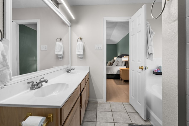 7612 Brittany Pl, Fort Worth, TX 76137 - ensuite bathroom with double vanity, tile patterned flooring, and baseboards