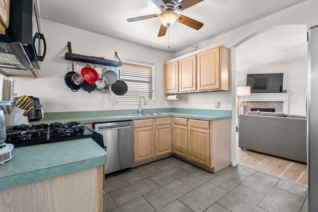 7612 Brittany Pl, Fort Worth, TX 76137 - kitchen featuring a sink, stainless steel dishwasher, light brown cabinetry, ceiling fan, and light tile patterned floors