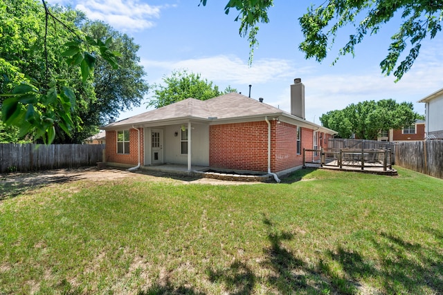 7612 Brittany Pl, Fort Worth, TX 76137 - back of house featuring brick siding, a chimney, a deck, and a patio area