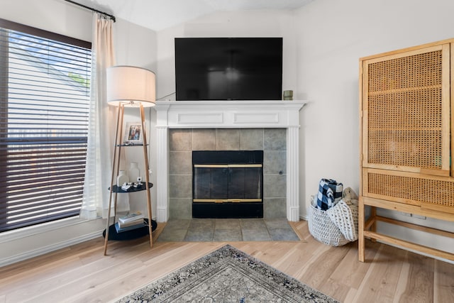 7612 Brittany Pl, Fort Worth, TX 76137 - detailed view of wood finished floors, a fireplace, and baseboards