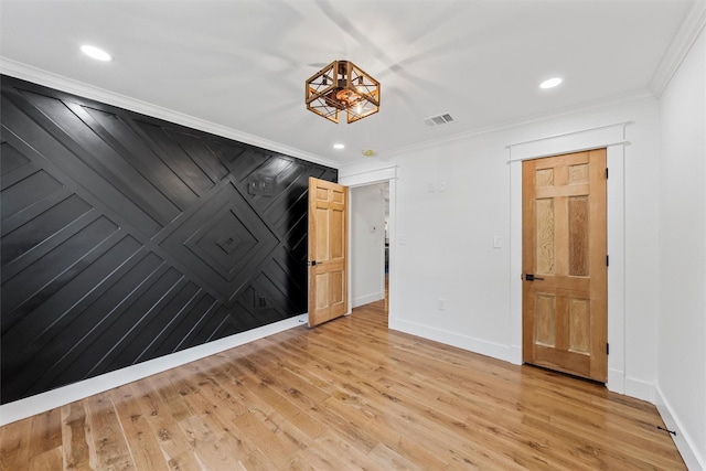 2925 Edmond Ave, Waco, TX 76707 - empty room with baseboards, crown molding, light wood finished floors, recessed lighting, and a chandelier