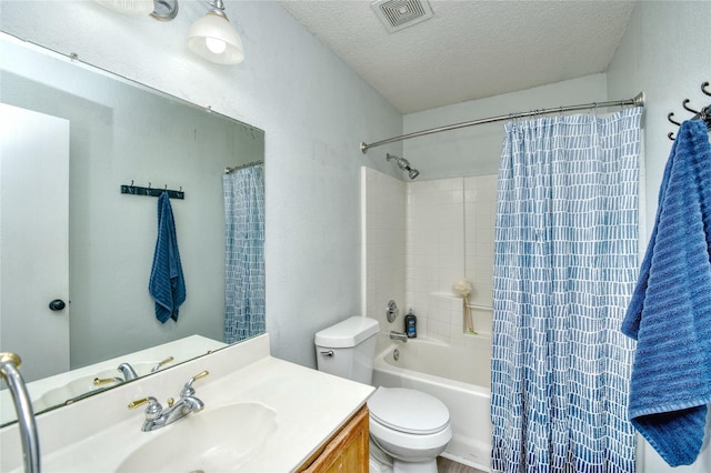 1209 Starpoint Ln, Wylie, TX 75098 - full bathroom with vanity, a textured ceiling, toilet, and shower / bath combo