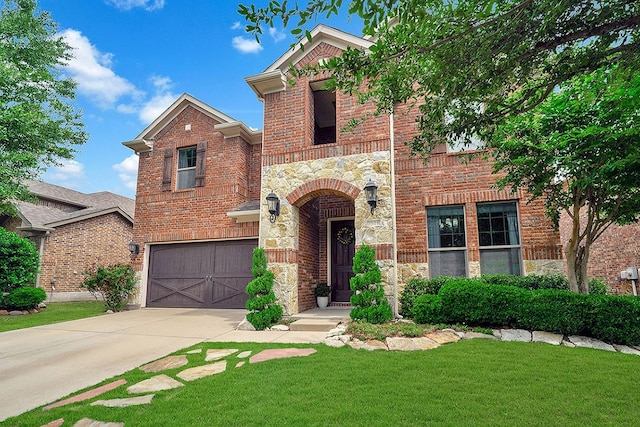 3916 Brook Wood Dr, Mckinney, TX 75071 - view of front of home featuring brick siding, an attached garage, stone siding, driveway, and a front yard