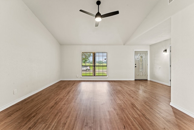 8810 Sugarberry Rd, Dallas, TX 75249 - unfurnished living room featuring lofted ceiling, ceiling fan, wood finished floors, and baseboards