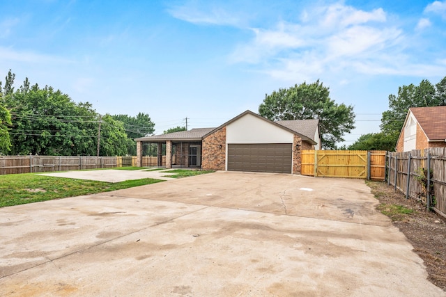 8810 Sugarberry Rd, Dallas, TX 75249 - view of front facade featuring an attached garage, concrete driveway, brick siding, and roof with shingles