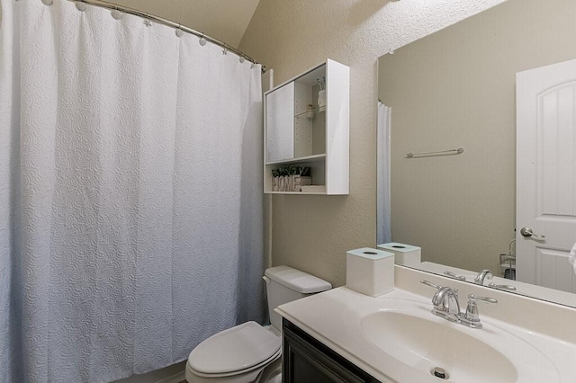 925 Lake Grove Dr, Little Elm, TX 75068 - full bathroom featuring toilet, vanity, a textured wall, and curtained shower