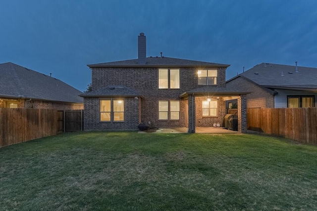 925 Lake Grove Dr, Little Elm, TX 75068 - rear view of property with a chimney, brick siding, and a patio area