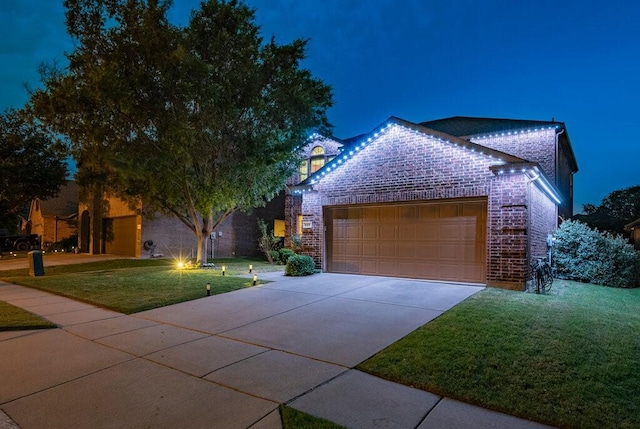 925 Lake Grove Dr, Little Elm, TX 75068 - view of front of house featuring brick siding, a garage, a yard, and driveway