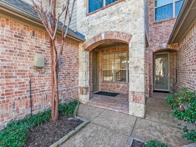6101 Eagle Nest Dr, Garland, TX 75044 - entrance to property with brick siding and stone siding