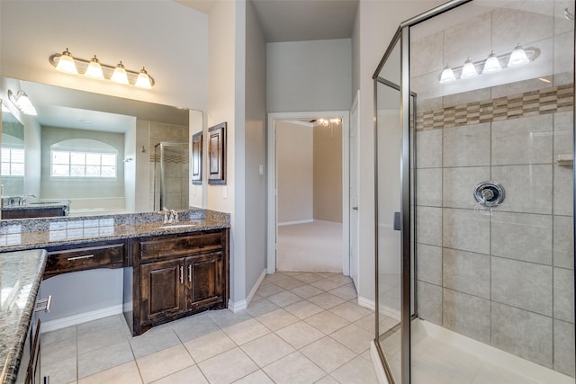 6101 Eagle Nest Dr, Garland, TX 75044 - bathroom with vanity, a shower stall, and tile patterned flooring