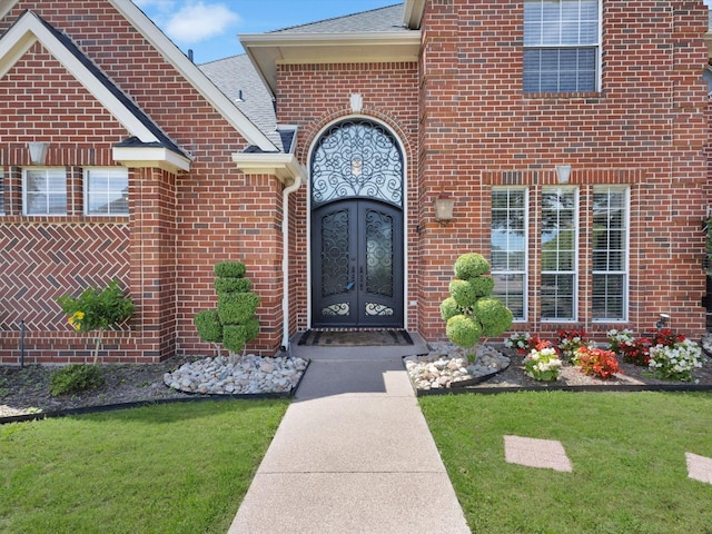 501 Las Lomas Dr, Heath, TX 75032 - entrance to property with french doors, brick siding, a lawn, and a shingled roof