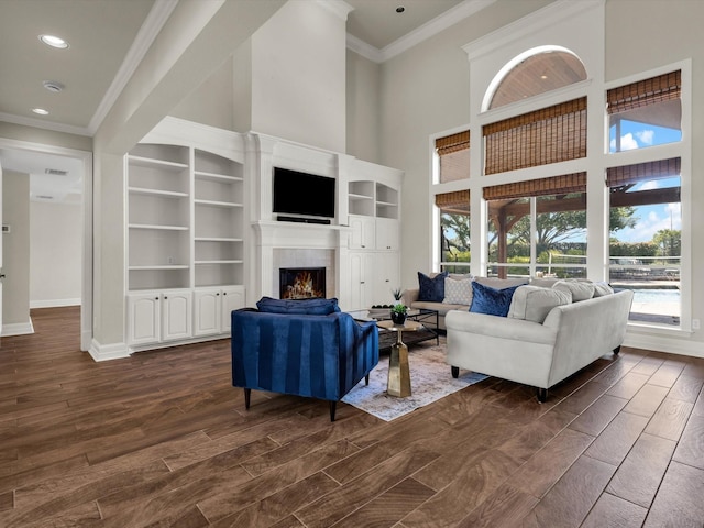 501 Las Lomas Dr, Heath, TX 75032 - living area featuring crown molding, a fireplace, dark wood-type flooring, recessed lighting, and a towering ceiling