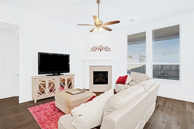 3514 Charleston Dr, Melissa, TX 75454 - living area with dark wood-style flooring, ceiling fan, baseboards, and a tiled fireplace
