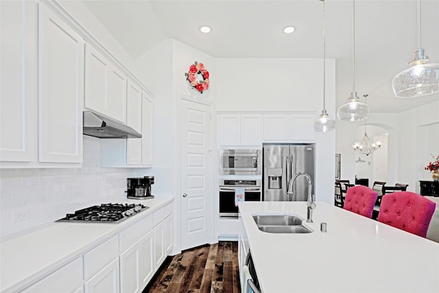 3514 Charleston Dr, Melissa, TX 75454 - kitchen with appliances with stainless steel finishes, a sink, under cabinet range hood, a chandelier, and light countertops