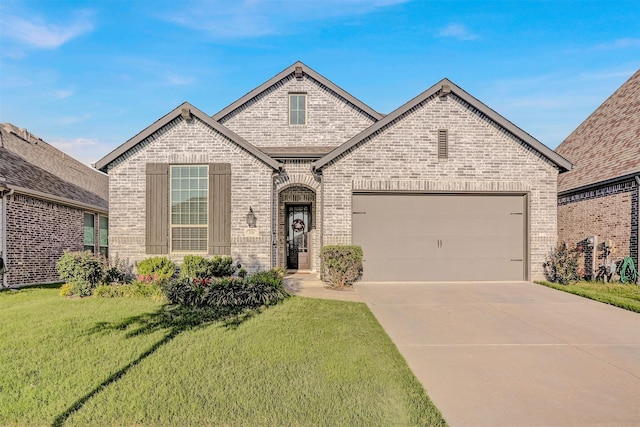 3514 Charleston Dr, Melissa, TX 75454 - french country home with brick siding, a front lawn, a garage, and driveway