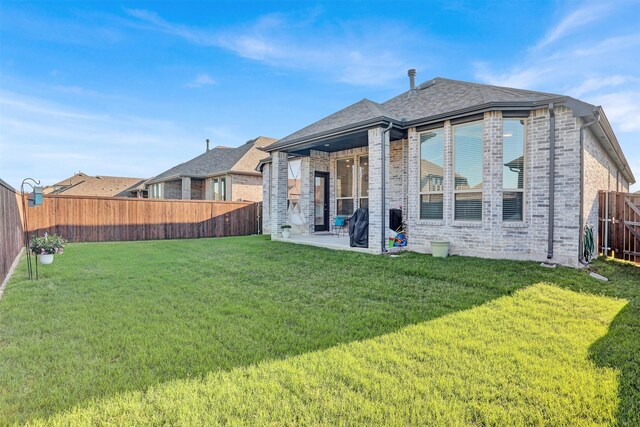 3514 Charleston Dr, Melissa, TX 75454 - back of house with brick siding, a patio area, and roof with shingles