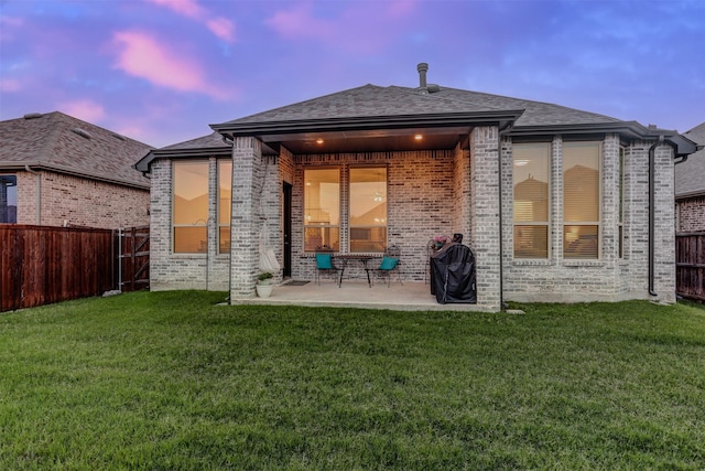 3514 Charleston Dr, Melissa, TX 75454 - back of house at dusk featuring a patio area, brick siding, and a shingled roof