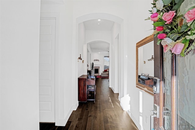 3514 Charleston Dr, Melissa, TX 75454 - hall featuring arched walkways, dark wood-style flooring, and baseboards