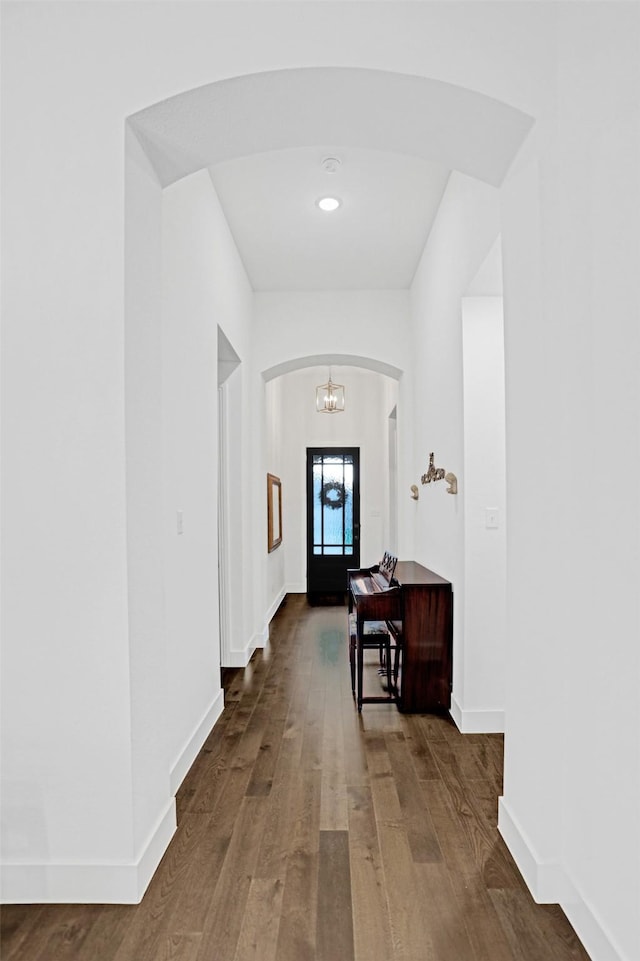 3514 Charleston Dr, Melissa, TX 75454 - hall featuring arched walkways, wood finished floors, a chandelier, and baseboards