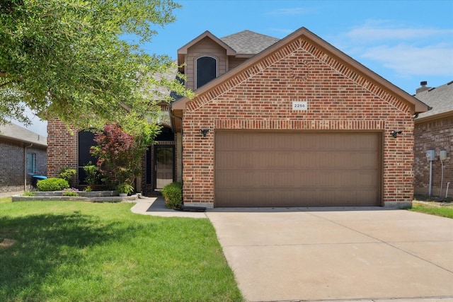 2256 Laurel Forest Dr, Fort Worth, TX 76177 - view of front of house with brick siding, a garage, driveway, and a front yard