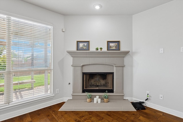 2256 Laurel Forest Dr, Fort Worth, TX 76177 - detailed view of a fireplace with raised hearth, baseboards, and wood finished floors
