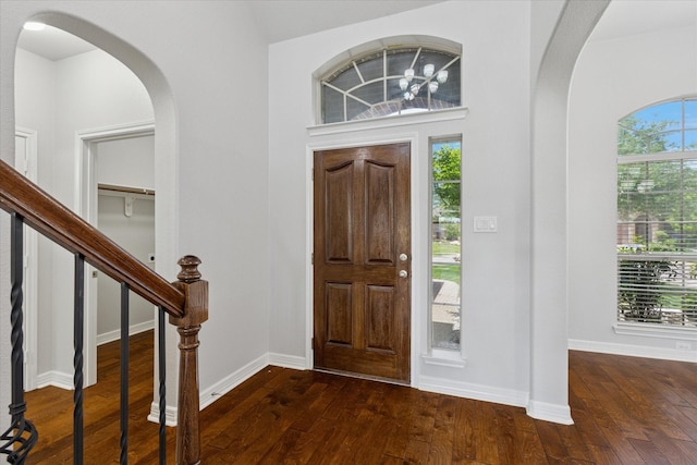 2256 Laurel Forest Dr, Fort Worth, TX 76177 - entrance foyer featuring dark wood-type flooring, baseboards, and arched walkways