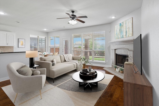 2256 Laurel Forest Dr, Fort Worth, TX 76177 - living area with healthy amount of natural light, wood finished floors, a ceiling fan, a fireplace with raised hearth, and recessed lighting