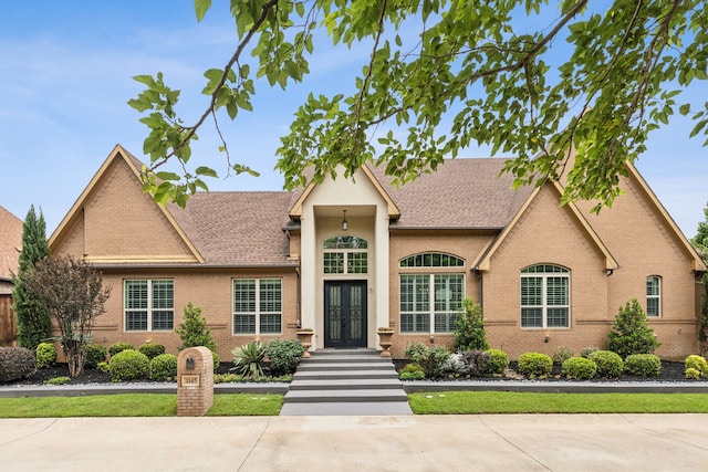 1145 Haven Cir, Southlake, TX 76092 - view of front of property featuring french doors, brick siding, and a shingled roof