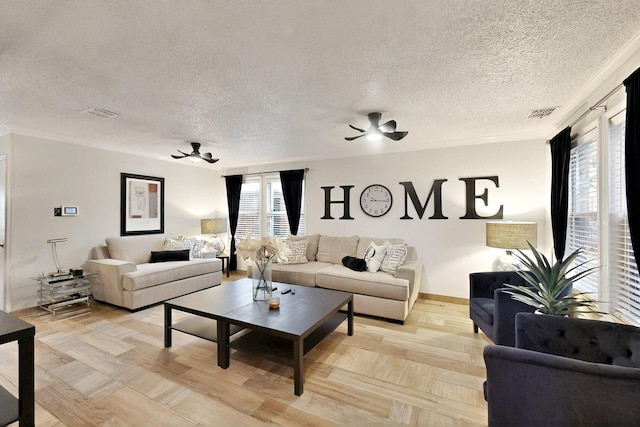 2908 Quail Run Dr, Mesquite, TX 75149 - living area with a ceiling fan, a textured ceiling, and baseboards