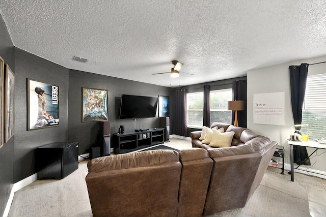 2908 Quail Run Dr, Mesquite, TX 75149 - living area with baseboards, a ceiling fan, light carpet, and a textured ceiling