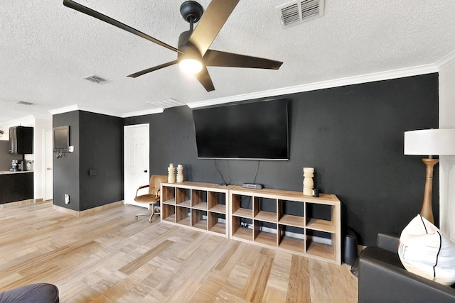 2908 Quail Run Dr, Mesquite, TX 75149 - living area featuring a ceiling fan, a textured ceiling, ornamental molding, baseboards, and wood finished floors