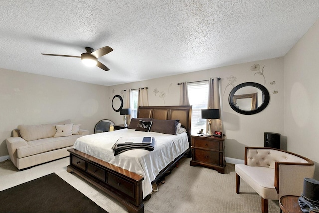 2908 Quail Run Dr, Mesquite, TX 75149 - bedroom featuring light carpet, ceiling fan, a textured ceiling, and baseboards