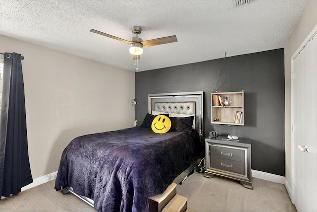 2908 Quail Run Dr, Mesquite, TX 75149 - bedroom with light colored carpet, a textured ceiling, baseboards, and ceiling fan