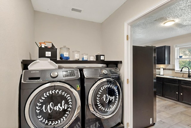2908 Quail Run Dr, Mesquite, TX 75149 - washroom featuring washing machine and clothes dryer