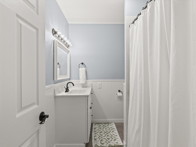 736 Westwood Dr, Sherman, TX 75092 - full bathroom featuring vanity, wainscoting, and a shower with shower curtain