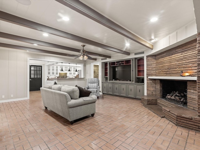 736 Westwood Dr, Sherman, TX 75092 - living area featuring brick flooring, a ceiling fan, a fireplace, recessed lighting, and beamed ceiling