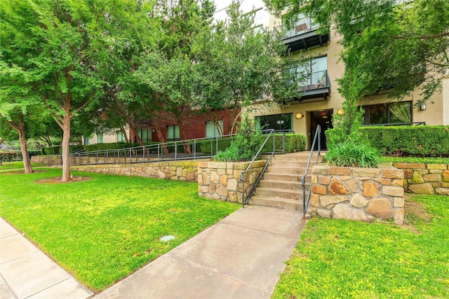 4605 Cedar Springs Rd Unit 201, Dallas, TX 75219 - view of front of home with stucco siding and a balcony