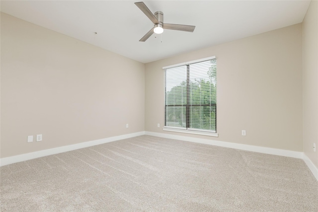 4605 Cedar Springs Rd Unit 201, Dallas, TX 75219 - spare room with baseboards, carpet flooring, and ceiling fan