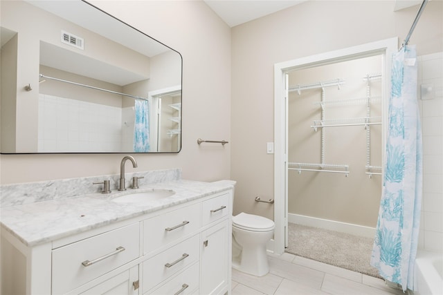4605 Cedar Springs Rd Unit 201, Dallas, TX 75219 - full bathroom with toilet, vanity, and tile patterned flooring