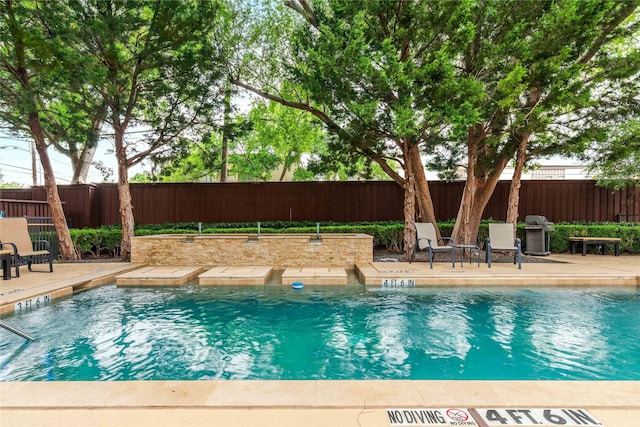 4605 Cedar Springs Rd Unit 201, Dallas, TX 75219 - community pool with a fenced backyard, a patio area, and a grill