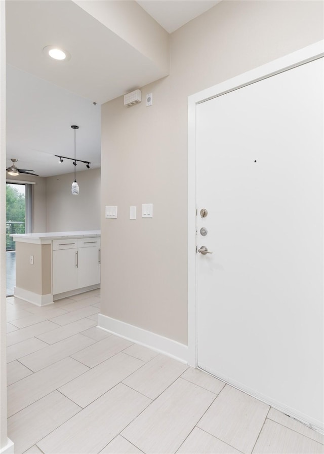 4605 Cedar Springs Rd Unit 201, Dallas, TX 75219 - foyer with a ceiling fan and baseboards
