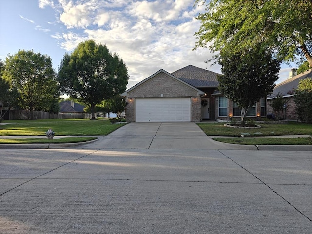 4415 Shady Elm Dr, Mansfield, TX 76063 - view of front of property featuring an attached garage, driveway, and brick siding