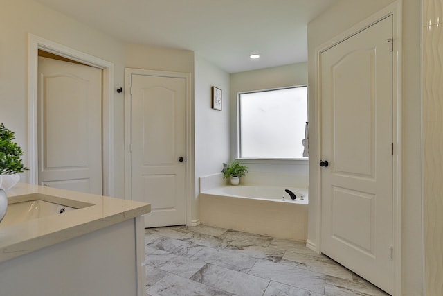 13725 Hickory Creek Dr, Haslet, TX 76052 - full bath with vanity, a bath, marble look tile flooring, and recessed lighting