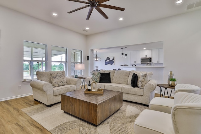 13725 Hickory Creek Dr, Haslet, TX 76052 - living area featuring light wood-style floors, ceiling fan, recessed lighting, and baseboards