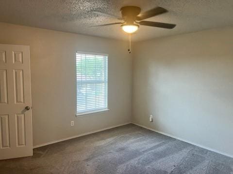 8412 Widgeon Way, Dallas, TX 75249 - carpeted spare room featuring a ceiling fan and a textured ceiling