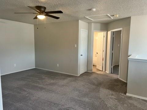 8412 Widgeon Way, Dallas, TX 75249 - empty room featuring a ceiling fan, carpet, and a textured ceiling